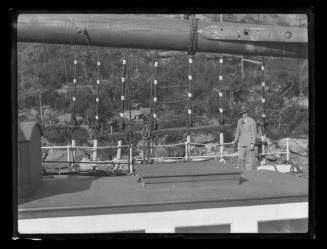 Man standing at the port rail of HELEN B STERLING in Kerosene Bay, Sydney Harbour