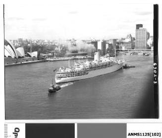P&O liner IBERIA departing Circular Quay with a tug boat pushing the starboard bow and another pulling the stern rope