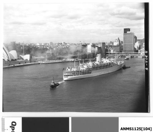 P&O liner IBERIA departing Sydney Harbour with one tug boat pushing the starboard bow and a second pulling on the stern rope