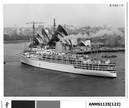 P&O liner IBERIA leaving Sydney with the stern rope trailing in the water and the bow rope connected to the tug