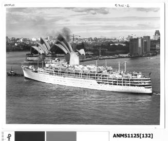 Departing P&O liner IBERIA across the entrance to Sydney Cove and with a tug boat pulling on the bow rope