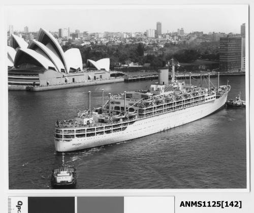 Outward bound P&O liner ORONSAY being turned around in Sydney Cove assisted by two tugboats