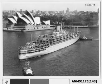 P&O liner ORONSAY preparing to depart Sydney with one tug pushing the starboard bow, and a second pulling the stern rope