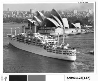 Outward bound liner ORONSAY passing Bennelong Point and the Sydney Opera House (under construction)