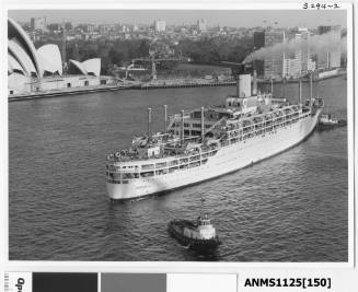 Departing liner ORONSAY being turned around in Sydney Harbour with a tug pushing the starboard bow and another pulling the stern rope