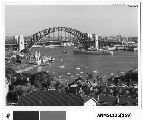 P&O liner ORONSAY passing under the Sydney Harbour Bridge with Luna Park visible & the Sydney Opera House which is under construction