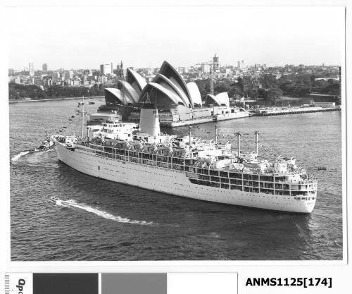 Departing P&O liner ARCADIA dressed with flags and about to pass the constuction site of the Sydney Opera House