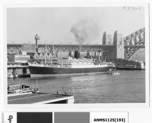 Passenger and cargo ship ARAMAC moored alongside Circular Quay with the stern of TJITARUM visible in Cambells Cove