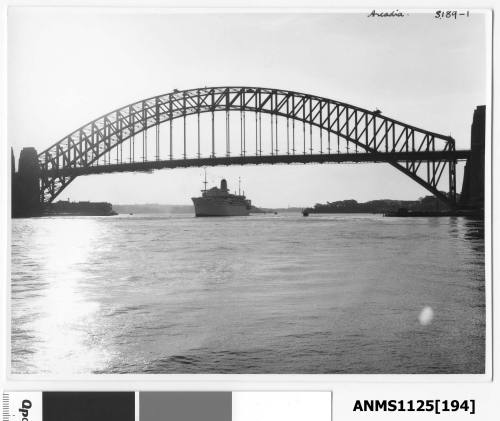 P&O liner ARCADIA departing Sydney and about to pass under the Sydney Harbour Bridge at sunset