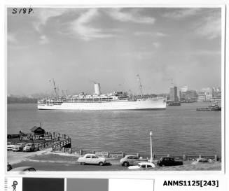 P&O passenger liner STRATHEDEN arriving at the entrance to Sydney Cove and being assisted by a tugboat