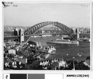 Outward bound P&O liner HIMALAYA passing under the Sydney Harbour Bridge with the back of Luna Park seen in the foreground