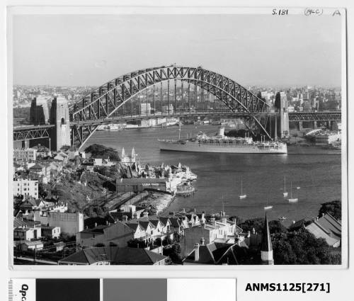 Departing P&O liner HIMALAYA  passing under the Sydney Harbour Bridge with a rear view of Luna Park in the foreground