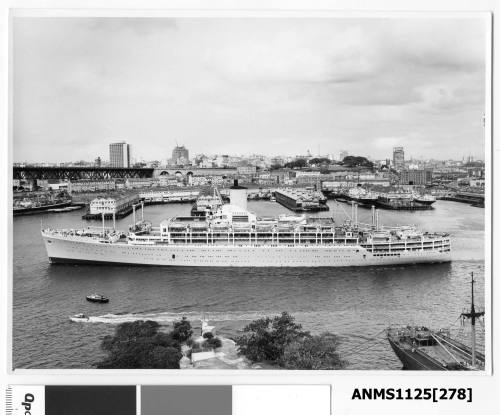 Departing P&O liner ORCADES approaching Sydney Harbour Bridge with the wharf sheds of Walsh Bay in the background