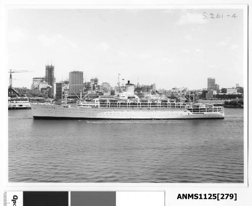 P&O liner ORCADES leaving Sydney with the Sydney Opera House under construction (seen centre left) and the Wharf sheds at Campbells Cove (centre right)