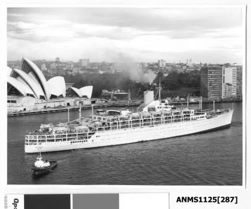 P&O liner ORCADES departing Sydney assisted by a tug and with the Sydney Opera House (construction nearing completion) visible in the background