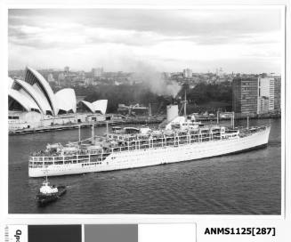 P&O liner ORCADES departing Sydney assisted by a tug and with the Sydney Opera House (construction nearing completion) visible in the background