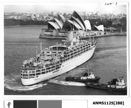 P&O liner ORCADES departing Sydney and being turned around by two tugs, with construction work on the Sydney Opera House seen in the background