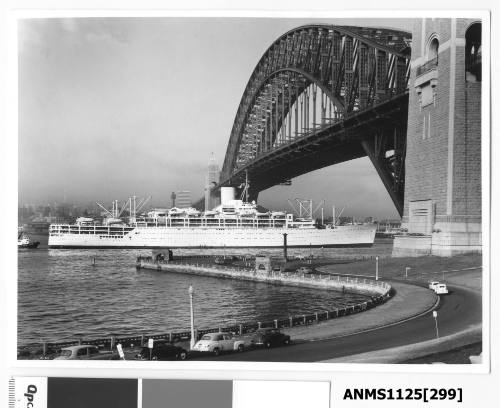 Incoming P&O liner ORCADES passing under the Sydney Harbour Bridge with an escorting tugboat seen at the liner’s stern