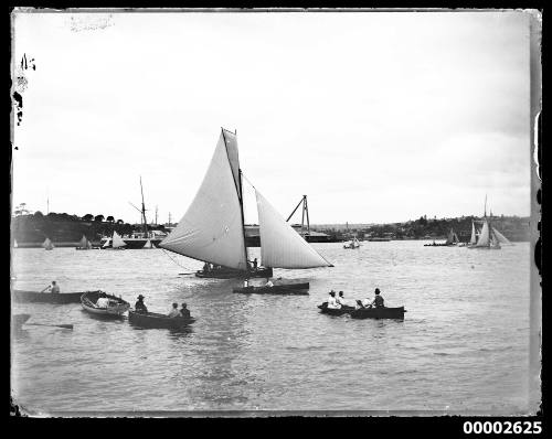 Regatta scene with large open boat and rowboats off Garden Island