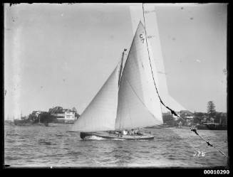 21-foot restricted class yacht sails on Sydney Harbour, C7 is at peak of mainsail.  ID No.s325 bRs