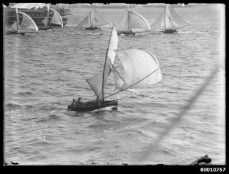 16-foot skiff with a distant group of 18-footers on Sydney Harbour