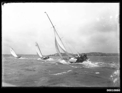 3 Yachts sailing in Sydney Harbour on a stormy day