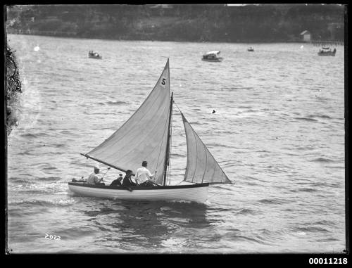 Clinker built boat sailing on Sydney Harbour