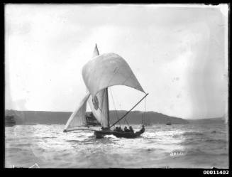 18-foot skiff with ballooning spinnaker on run down Sydney Harbour with spectator craft in distance