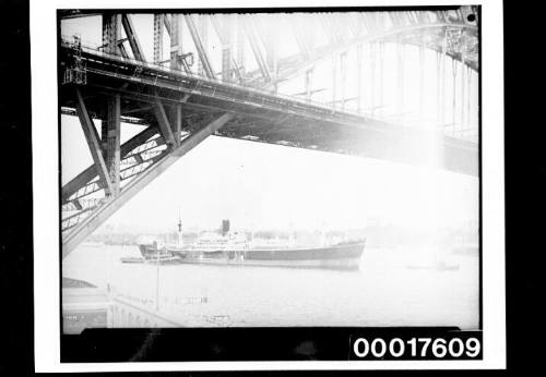 Ship passing under the Sydney Harbour Bridge