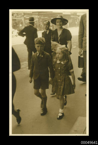 Margaret and Raleigh Helm walking with their mother, Martin Place