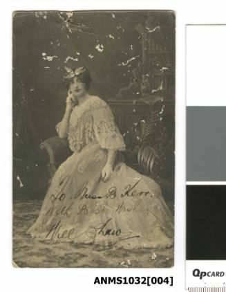Postcard featuring a black and white photograph of Will Shaw dressed as a woman
