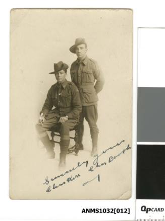 Postcard featuring a black and white photograph of two men in their army uniforms