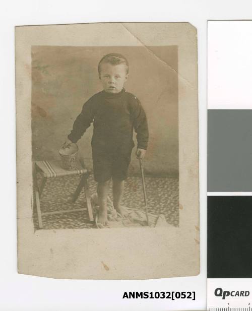 Young boy with his beach bucket