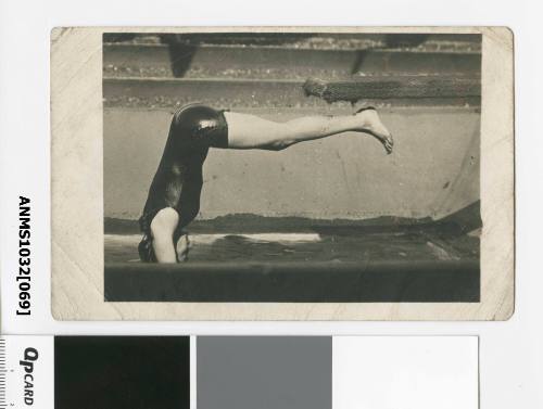 A woman diving into the water, with her legs horizontal, presumably Beatrice Kerr