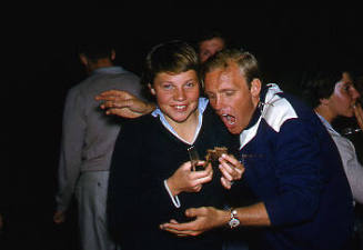 Ilsa Konrads and young man at a barbeque