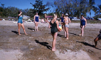 Young women playing on a beach, Townsville