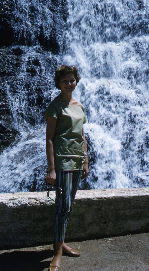 Eve Konrads in front of a waterfall