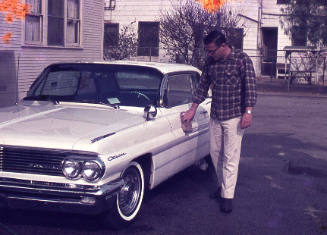 Bob Baker next to a car