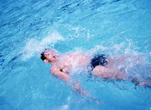 John Magstone performing back stroke