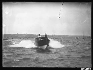 Motor launch at speed on Sydney Harbour