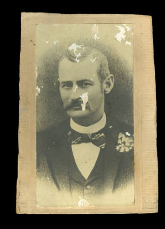 A portrait drawing of a man with a moustache, and wearing a jacket and bow tie