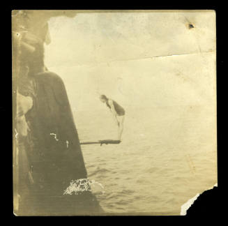 Photograph of Beatrice Kerr standing on a diving board