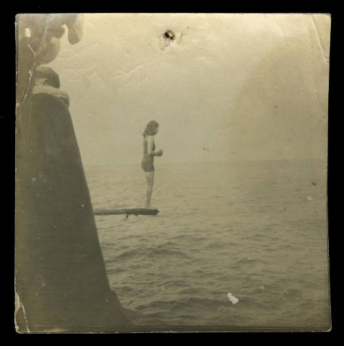 Photograph of Beatrice Kerr standing on a diving board