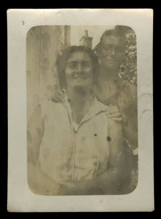 Woman, probably Beatrice Kerr, with a young man holding onto her shoulders