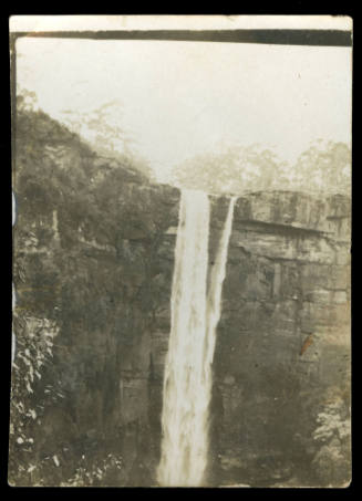 Waterfall cascading over a rock wall