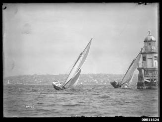 18-foot skiffs DEFIANCE and YENDYS round Weding Cake channel marker near Sow and Pigs reef on Sydney Harbour