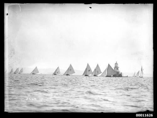 18-footer fleet rounds the Wedding Cake channel marker on Sydney Harbour