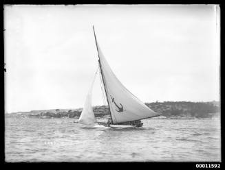 18-foot skiff YENDYS sails past Nielsen Park on Sydney Harbour with lee cloth in place