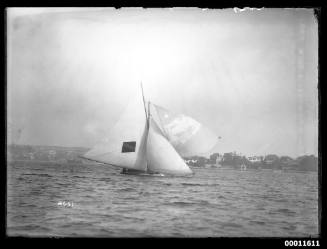 18-foot skiff under full rig passes Point Piper Sydney Harbour