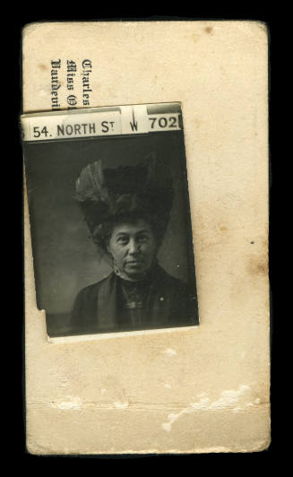 A head shot of a woman, attached to a business card